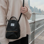 Herschel Nova Crossbody Mini Bag in Black, worn crossbody